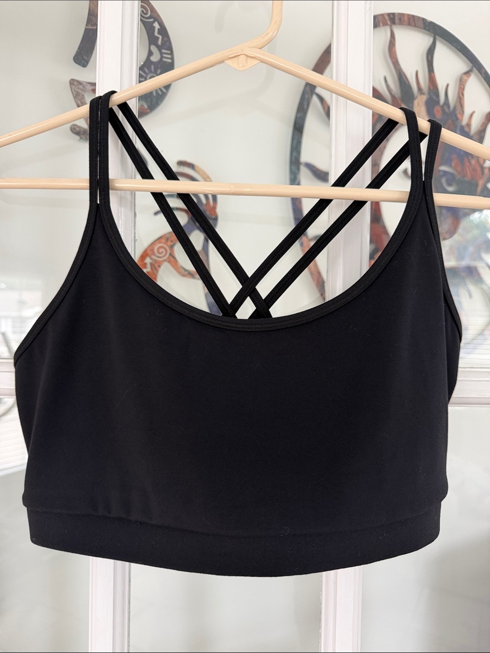 5/$20 Four Laps size L sports bra in black w, criss-cross straps